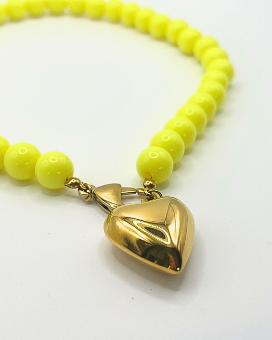 Gele kralenketting met hart