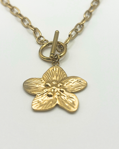 Goudkleurige schakelketting met grote bloem